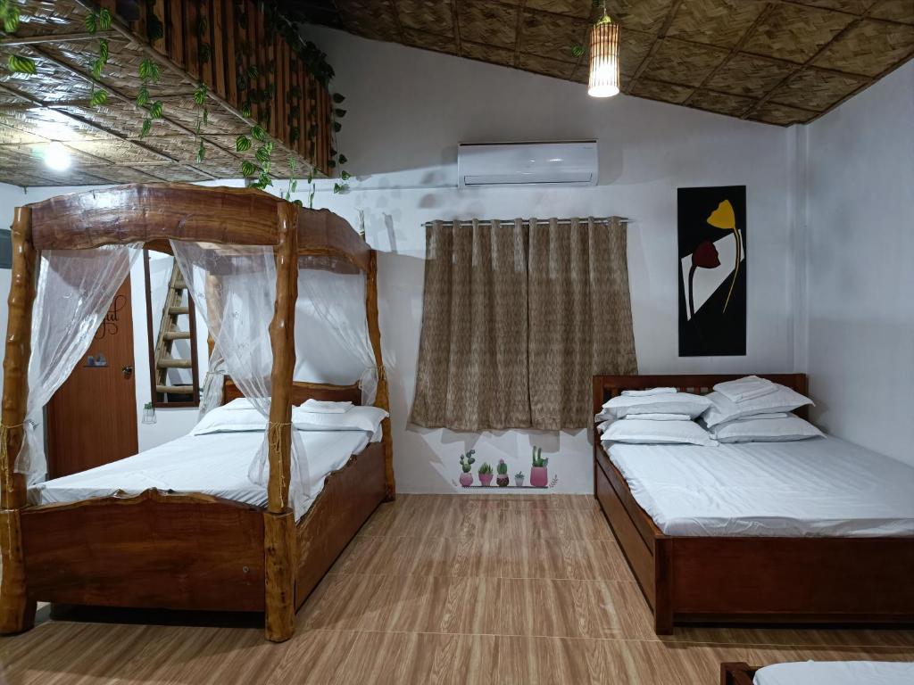 Postel nebo postele na pokoji v ubytování ANNI'S BEACH HOUSE