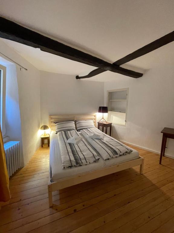 Postel nebo postele na pokoji v ubytování Tipica casa ticinese a Carona