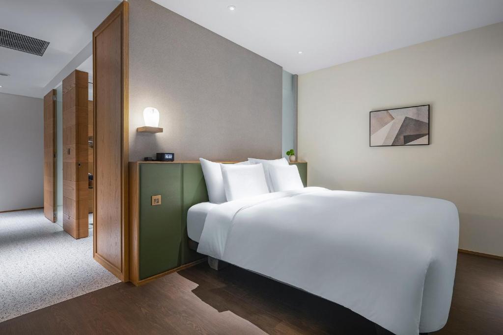 Postel nebo postele na pokoji v ubytování Humble Boutique Hotel