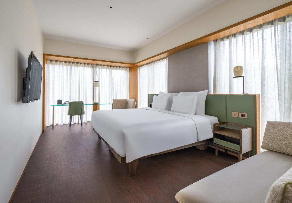 Postel nebo postele na pokoji v ubytování Humble Boutique Hotel