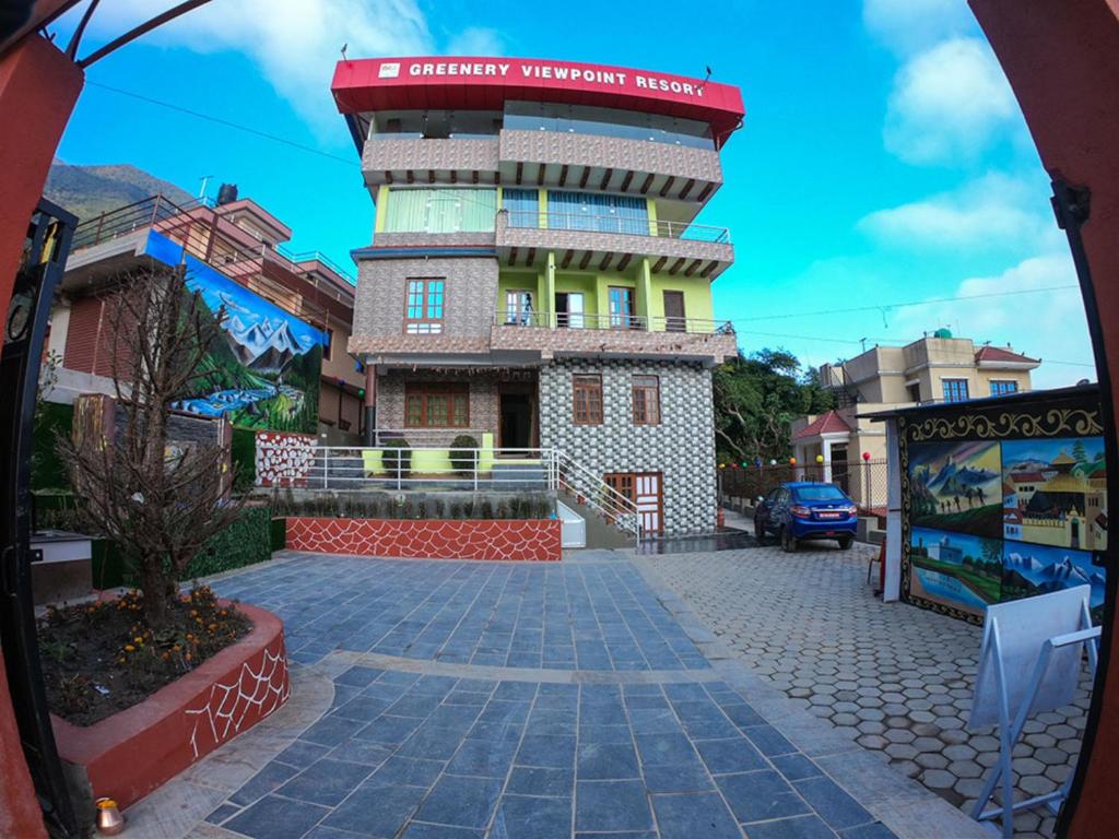 a building with a sign on top of it at Greenery View Point Resort in Kathmandu