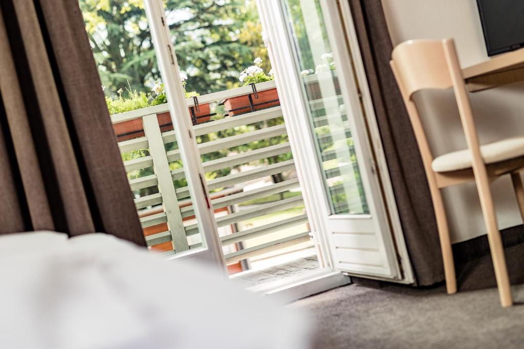 Postel nebo postele na pokoji v ubytování Hotel Heide Park