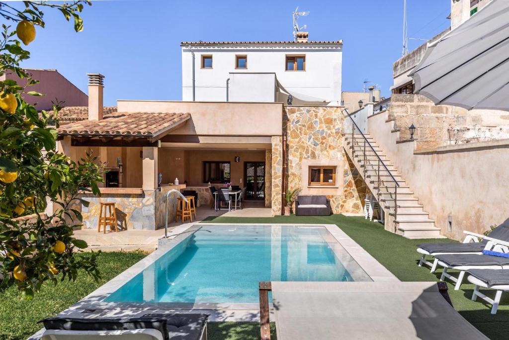 a pool in the backyard of a house at Casa Magui in Capdepera