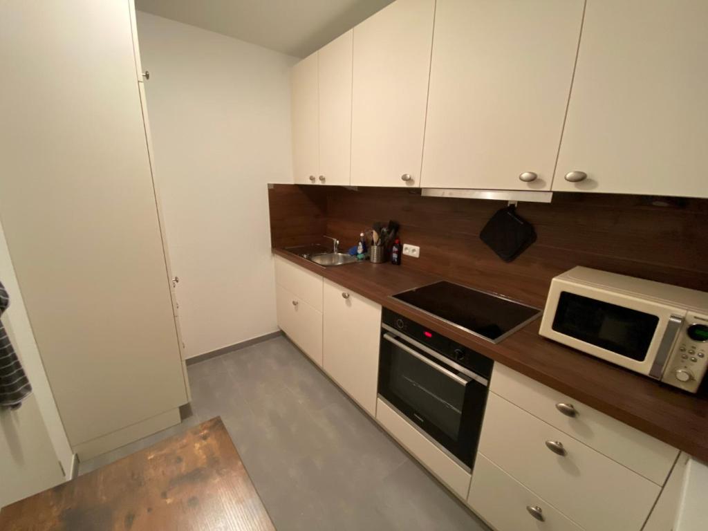 Kuchyň nebo kuchyňský kout v ubytování Amrumer Schatztruhe mit Loggia und Meerblick