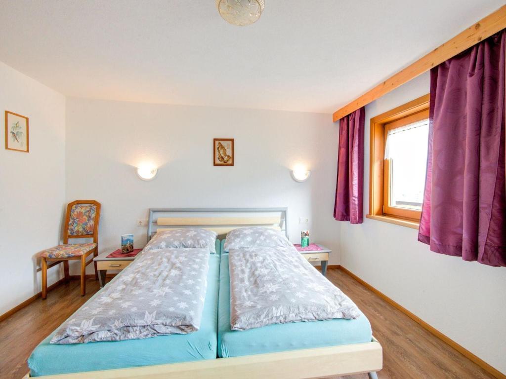 Posteľ alebo postele v izbe v ubytovaní Scenic Apartment in Tirol with Garden