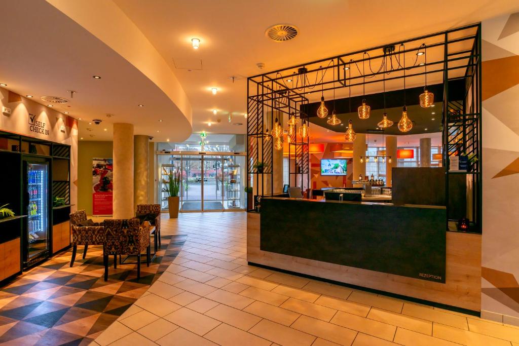 TV a/nebo společenská místnost v ubytování Best Western Premier IB Hotel Friedberger Warte