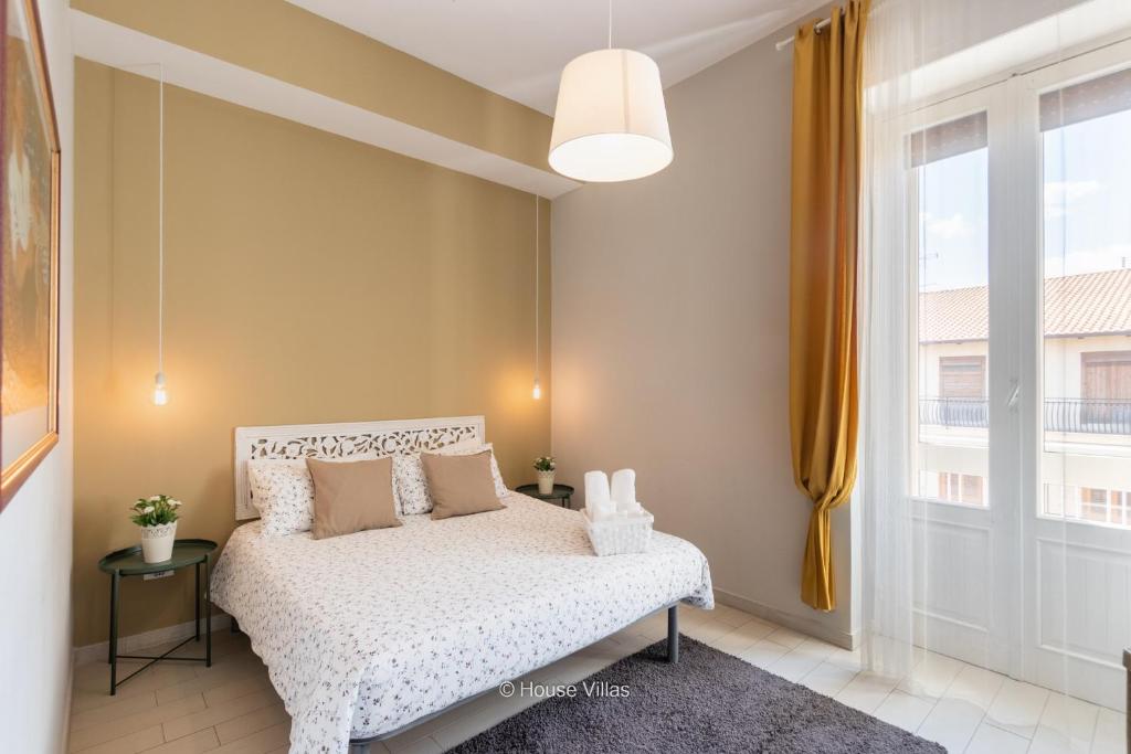 Postel nebo postele na pokoji v ubytování Il 49 Rooms Noto