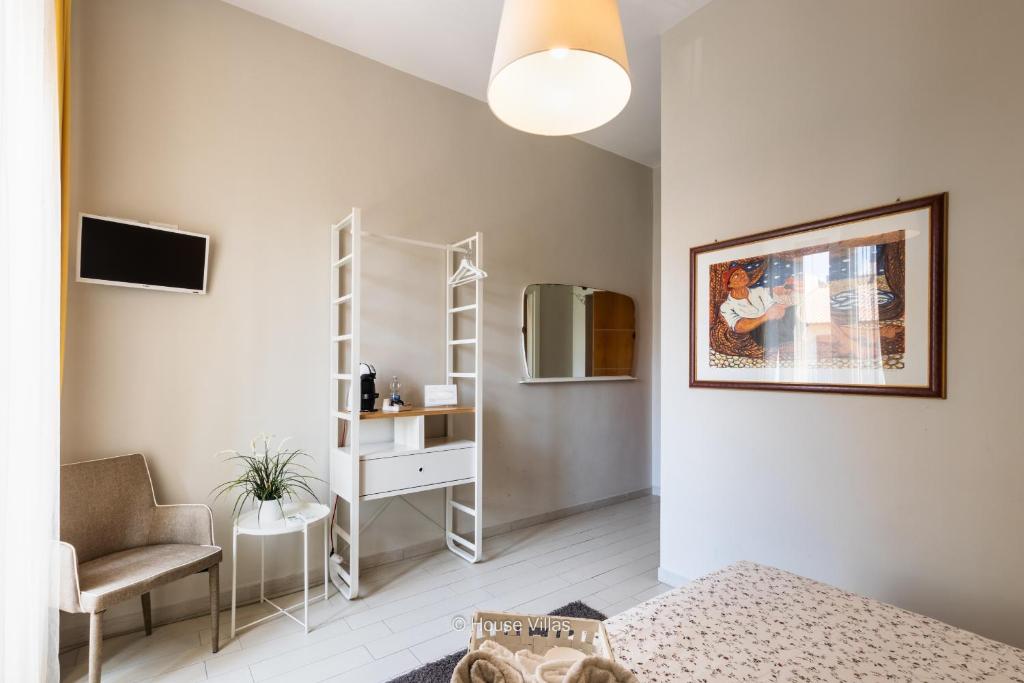 Postel nebo postele na pokoji v ubytování Il 49 Rooms Noto
