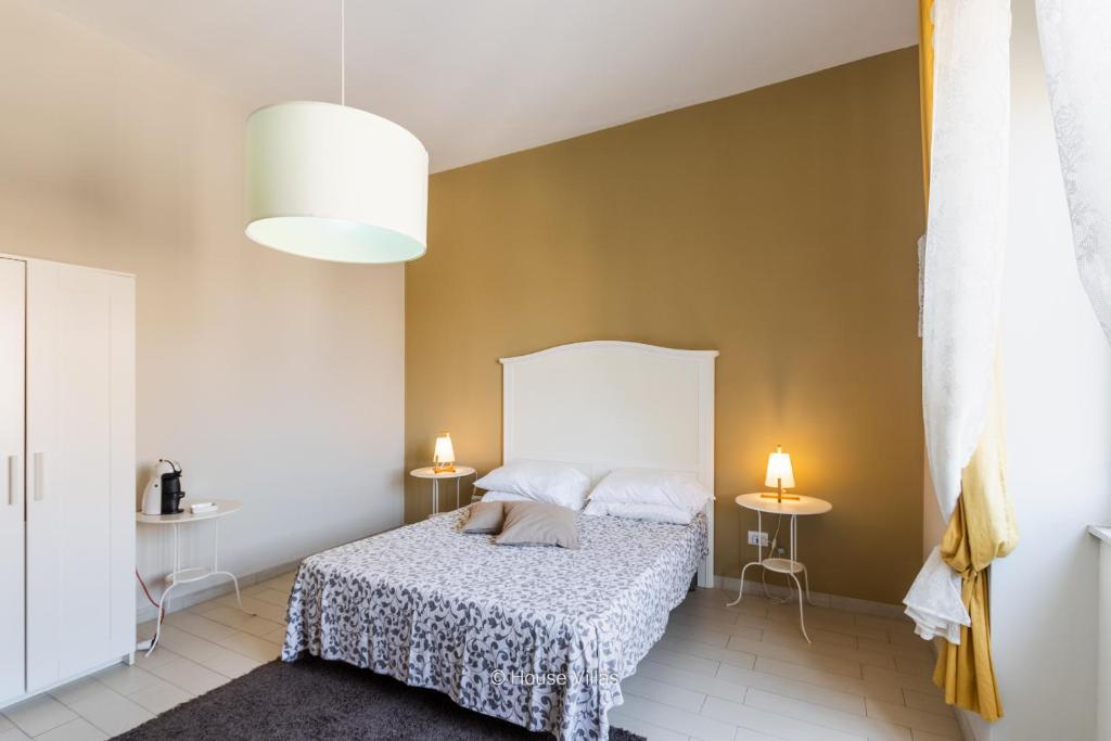 Postel nebo postele na pokoji v ubytování Il 49 Rooms Noto
