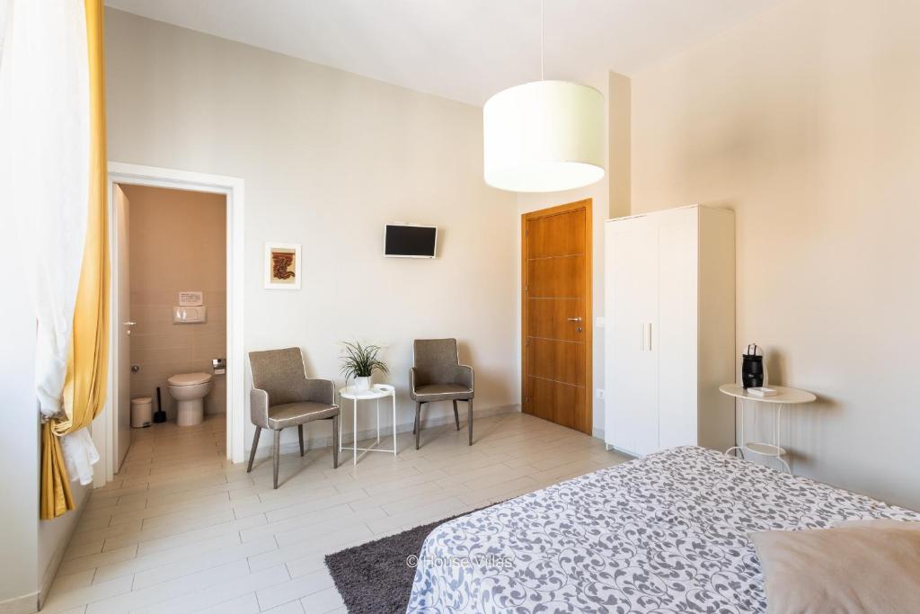 Postel nebo postele na pokoji v ubytování Il 49 Rooms Noto
