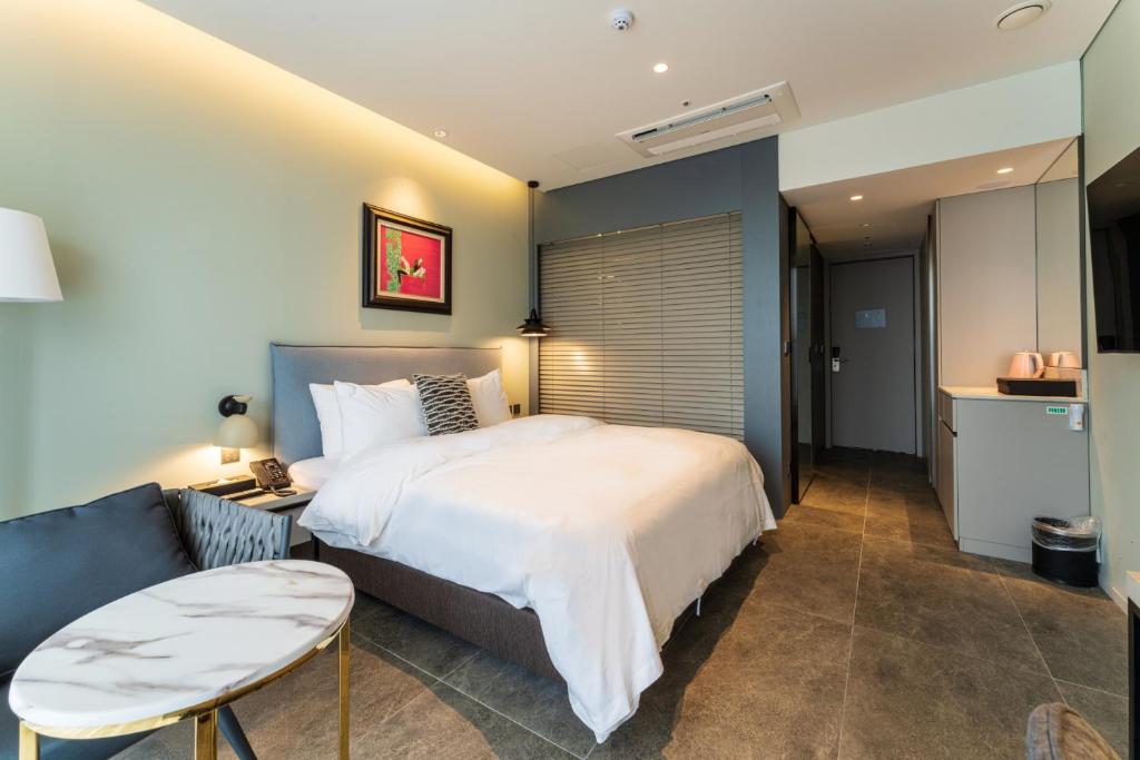 Postel nebo postele na pokoji v ubytování Hotel SoulHada