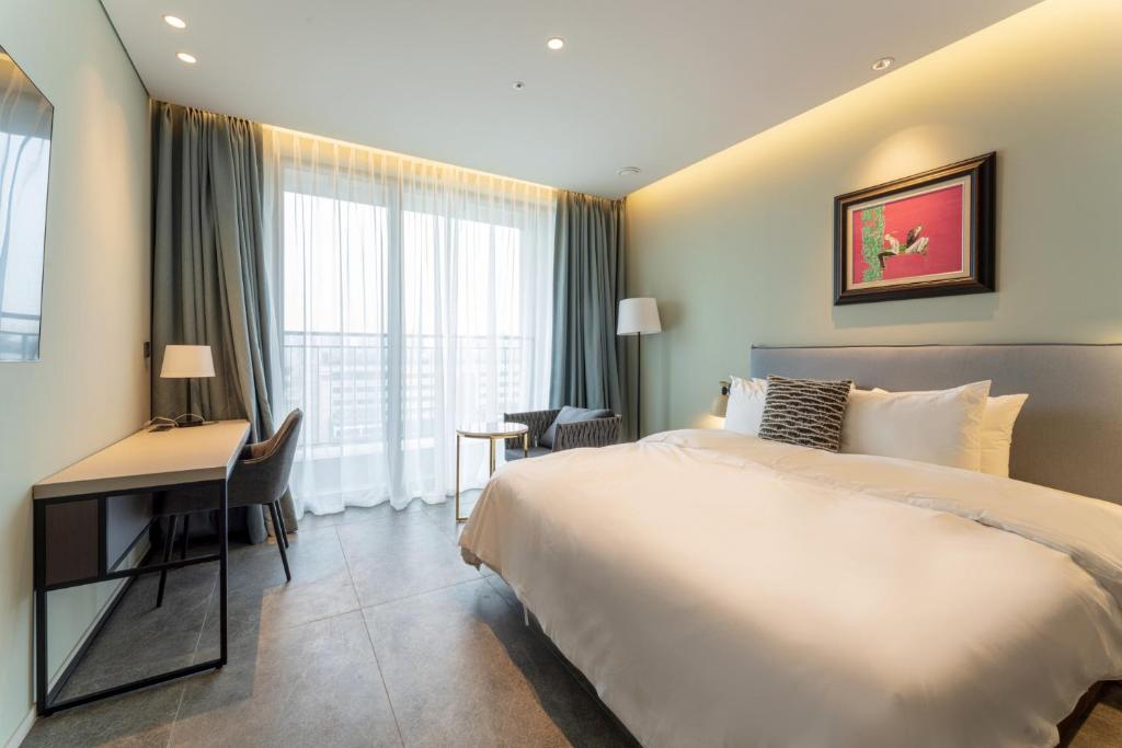 Postel nebo postele na pokoji v ubytování Hotel SoulHada