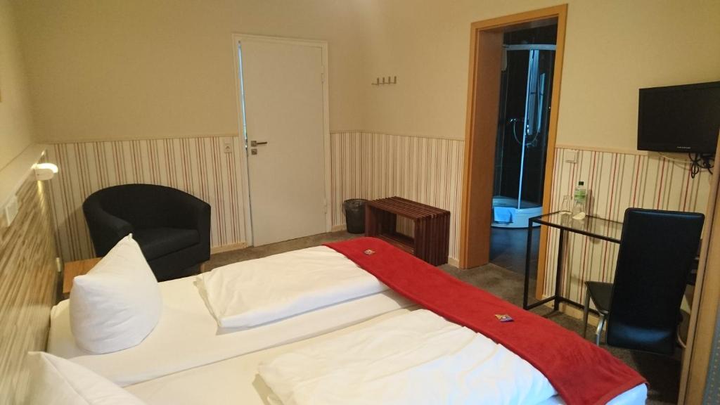 Postel nebo postele na pokoji v ubytování Hotel Kapelle Bed & Breakfast
