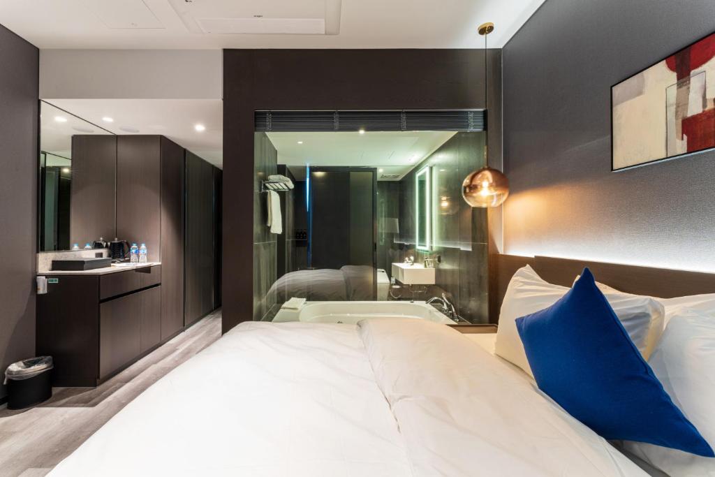 Postel nebo postele na pokoji v ubytování Hotel SoulHada