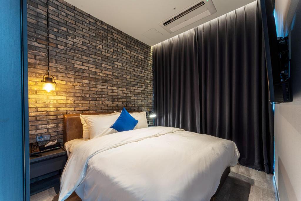 Postel nebo postele na pokoji v ubytování Hotel SoulHada