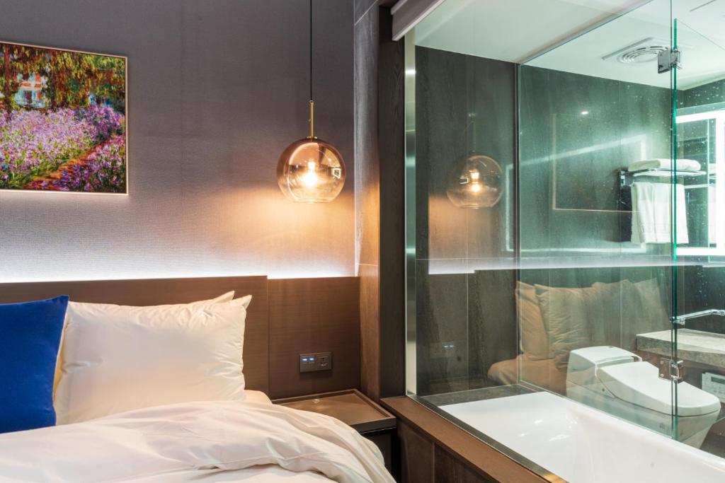Postel nebo postele na pokoji v ubytování Hotel SoulHada