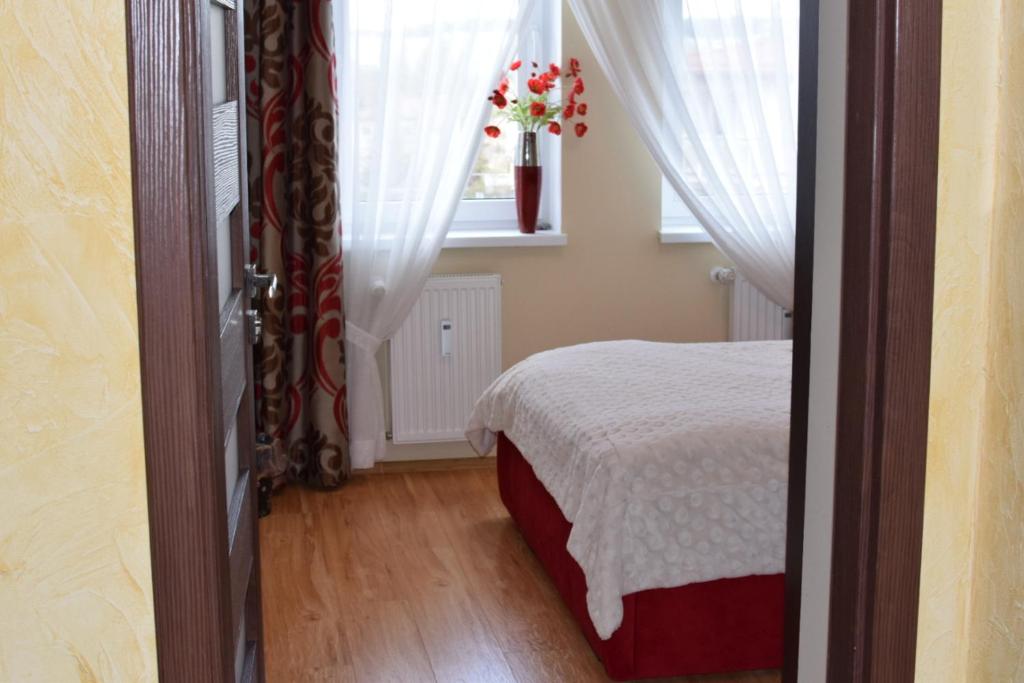 Posteľ alebo postele v izbe v ubytovaní Apartament Galeria Warmińska