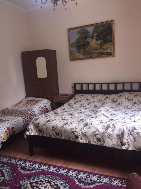 Postel nebo postele na pokoji v ubytování Гостевой дом Кристина