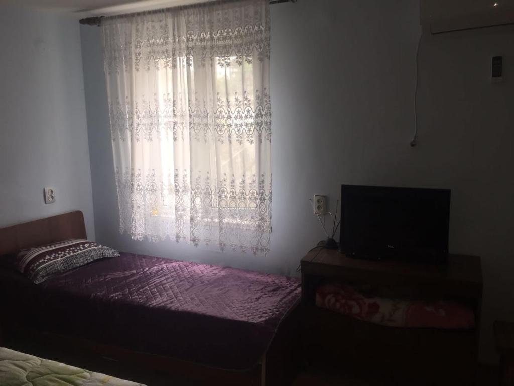 Postel nebo postele na pokoji v ubytování Гостевой дом Кристина