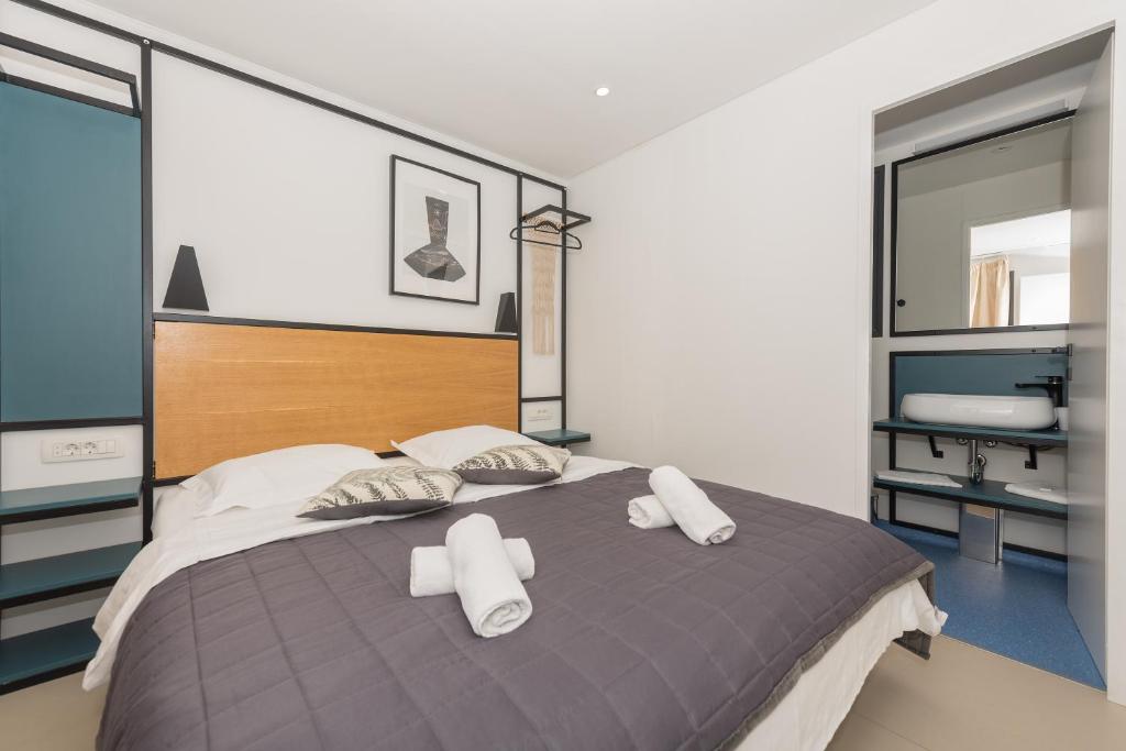 Postel nebo postele na pokoji v ubytování Riviera Mobile Home