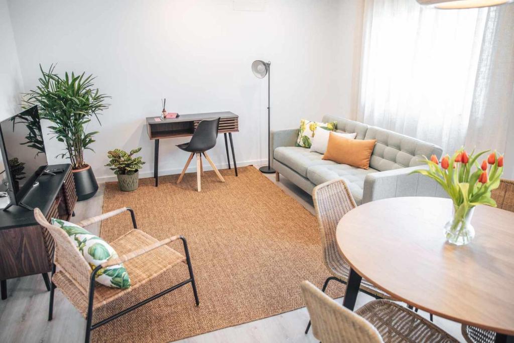 a living room with a couch and a table at Casa dos Capuchos in Leiria