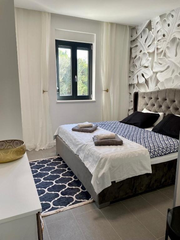 Posteľ alebo postele v izbe v ubytovaní Apartments Fortes Fortuna
