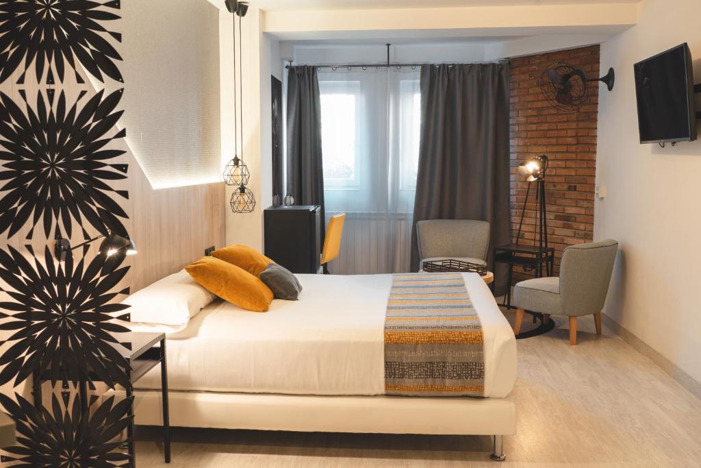 Postel nebo postele na pokoji v ubytování Hotel Onyarbi