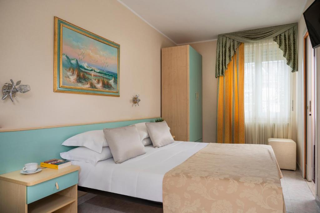 Postel nebo postele na pokoji v ubytování Albergo Ristorante Pozzi