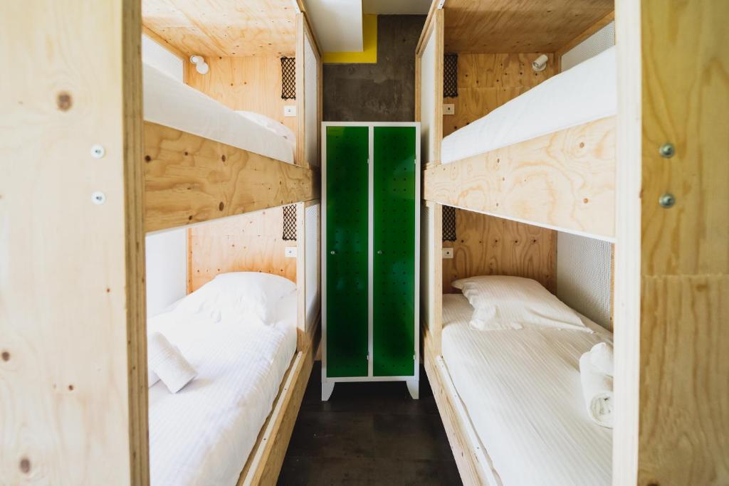 Postel nebo postele na pokoji v ubytování HÔTEL LE TERRE SAINTE