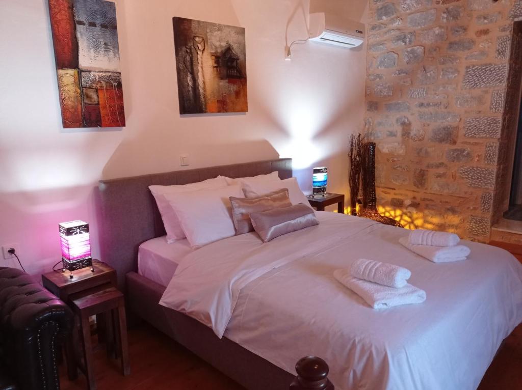 Postel nebo postele na pokoji v ubytování Mani Blue Tower