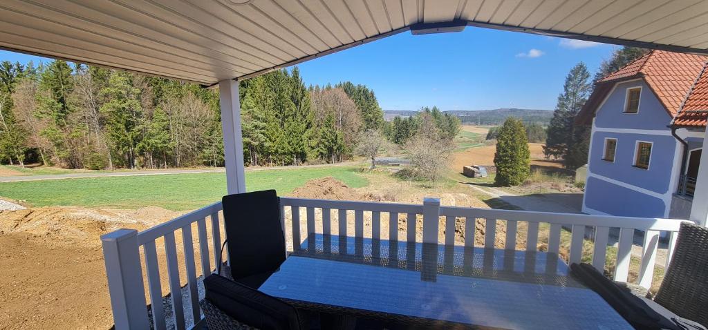 a porch with a view of a house at Haus Ballum in Birgland