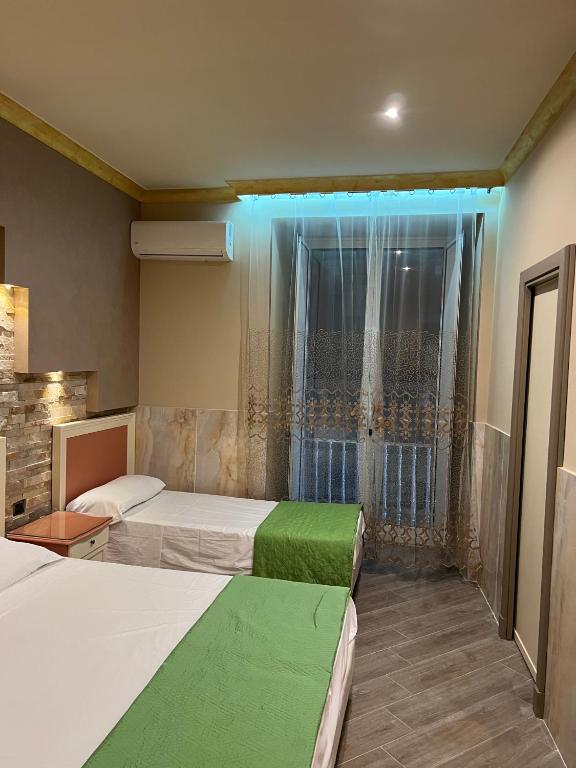 Cama o camas de una habitación en Hotel Iris