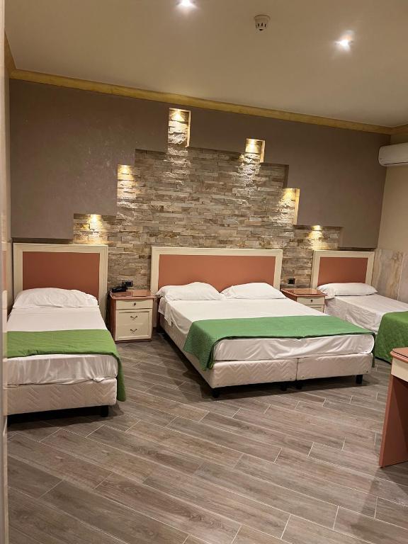 Cama o camas de una habitación en Hotel Iris