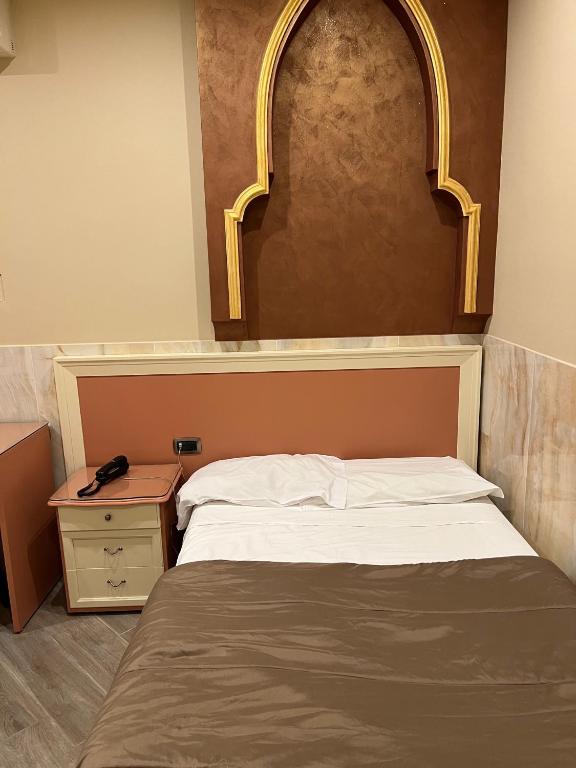 Cama o camas de una habitación en Hotel Iris