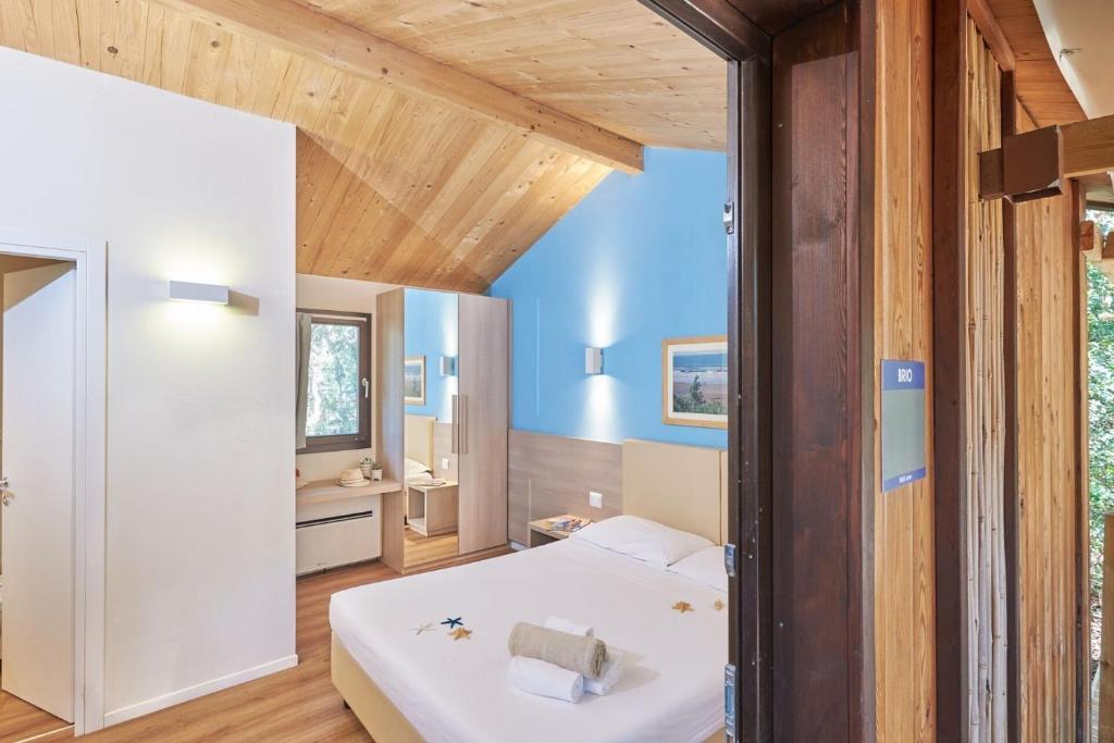Postel nebo postele na pokoji v ubytování Paradù EcoVillage & Resort