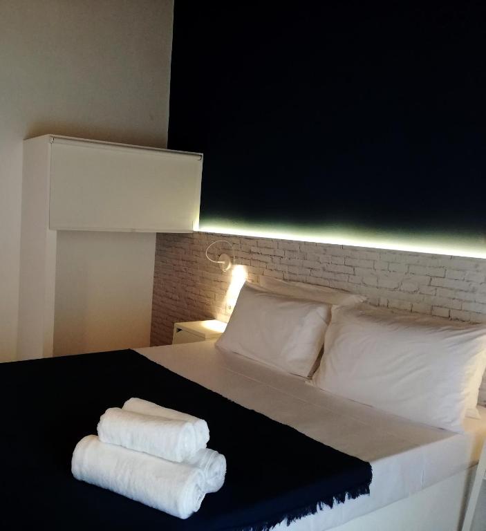 Postel nebo postele na pokoji v ubytování Rigas Rooms
