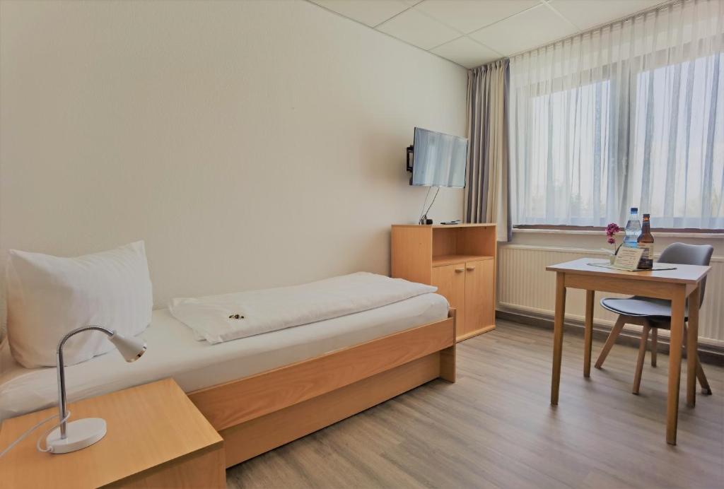 TV a/nebo společenská místnost v ubytování Pension Boddenblick