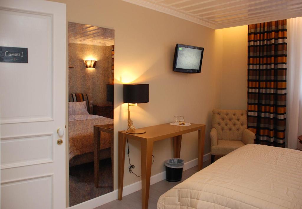 Postel nebo postele na pokoji v ubytování il Palazzo Rooms & Suites