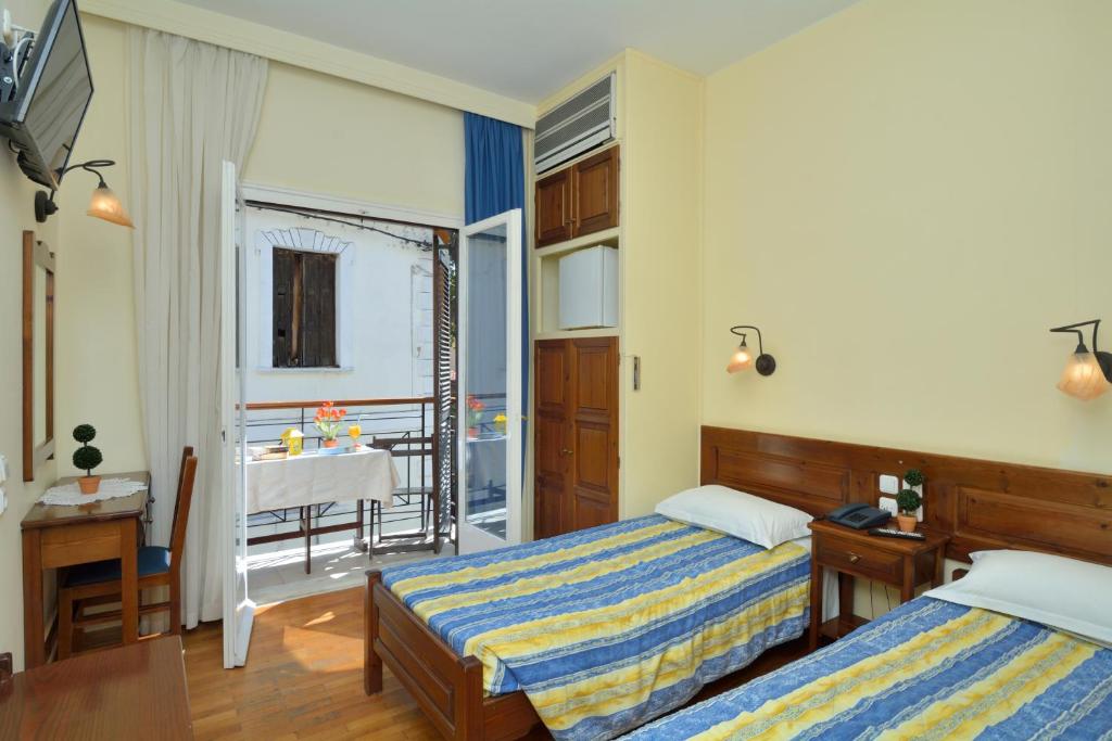 Postel nebo postele na pokoji v ubytování Katia Hotel