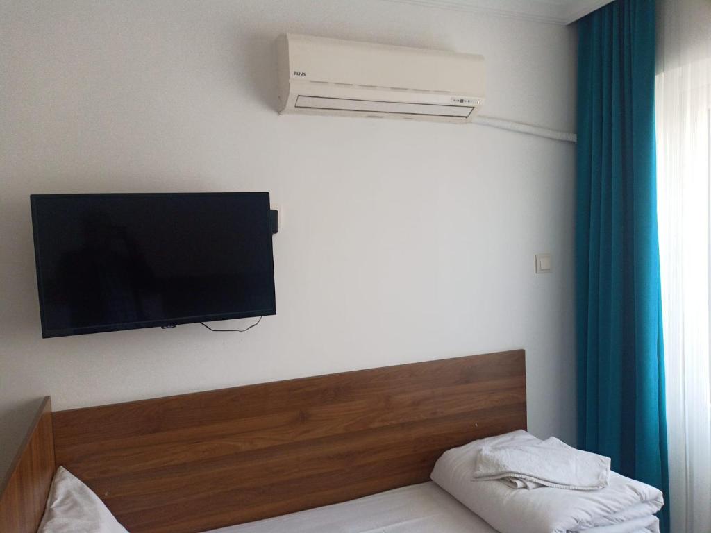 Postel nebo postele na pokoji v ubytování GÜVEN HOTEL