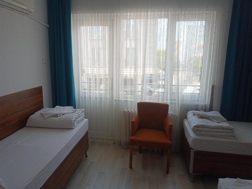 Postel nebo postele na pokoji v ubytování GÜVEN HOTEL