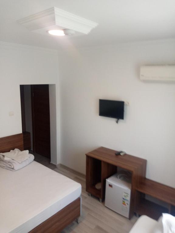 Postel nebo postele na pokoji v ubytování GÜVEN HOTEL