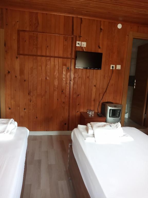 Postel nebo postele na pokoji v ubytování GÜVEN HOTEL