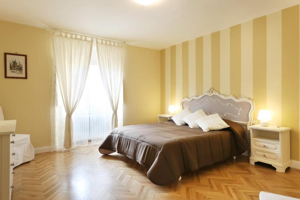 Ένα ή περισσότερα κρεβάτια σε δωμάτιο στο Flora - Sweet Dreams in Florence
