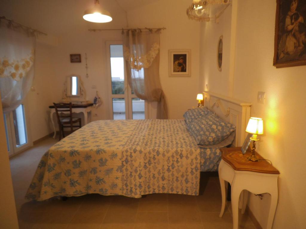 Postel nebo postele na pokoji v ubytování Le Bagnanti Suite