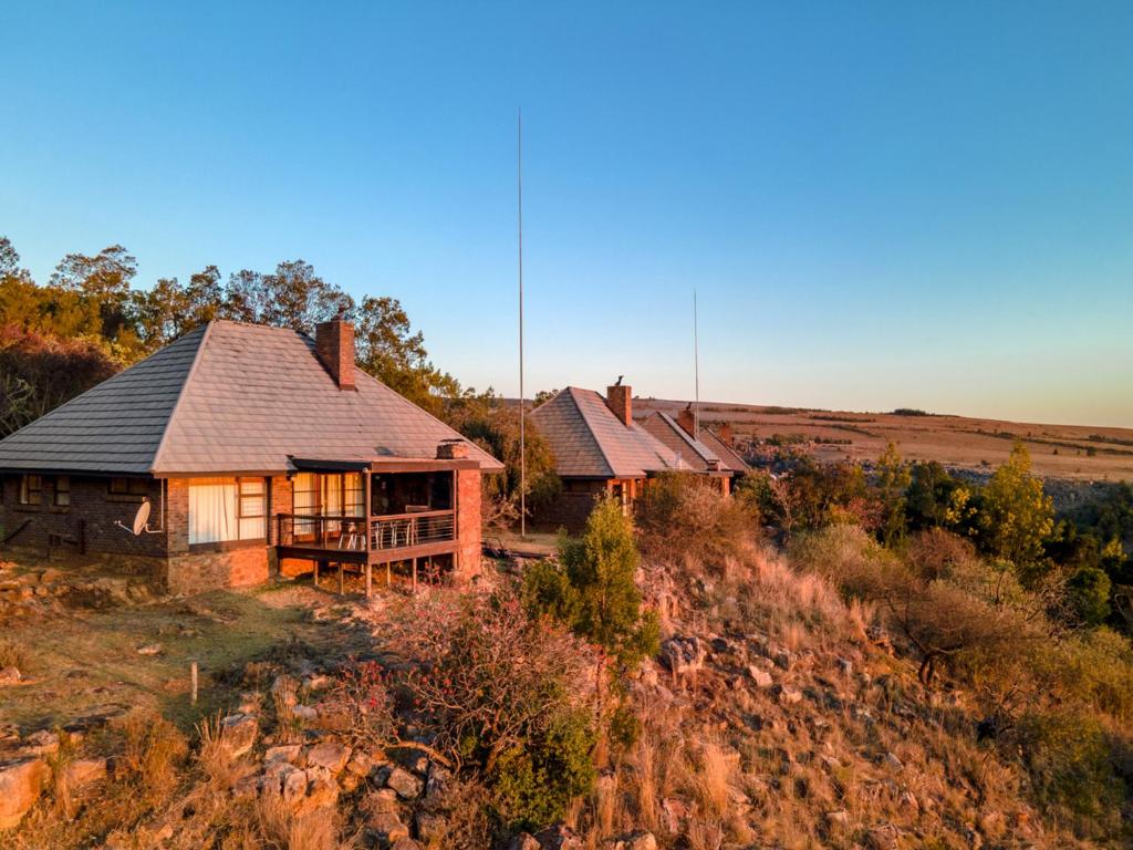 an aerial view of two houses on a hill at Crystal Springs Mountain Lodge in Pilgrimʼs Rest