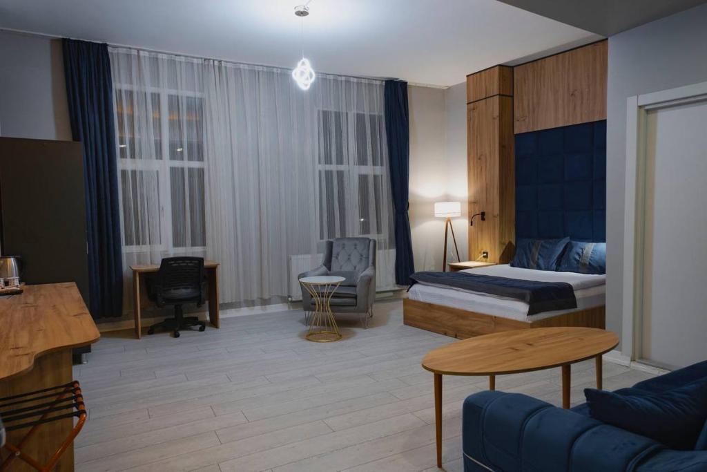 A bed or beds in a room at Grand Catalkaya Hotel