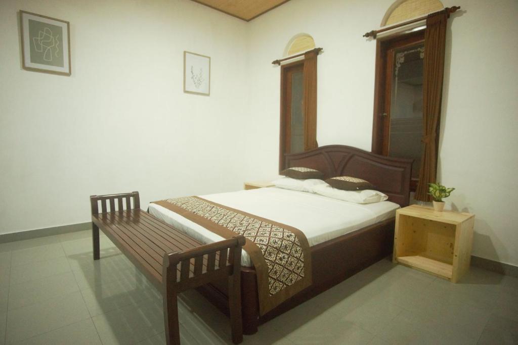 Postel nebo postele na pokoji v ubytování Ubud Dream
