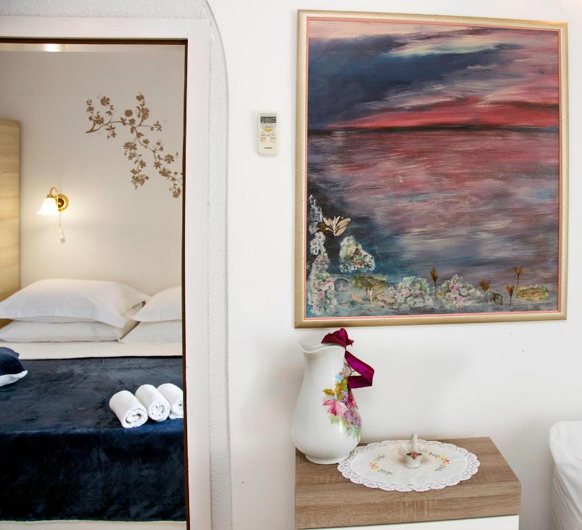 Posteľ alebo postele v izbe v ubytovaní Apartmani Gloria