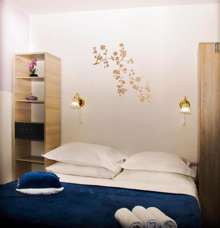 Posteľ alebo postele v izbe v ubytovaní Apartmani Gloria